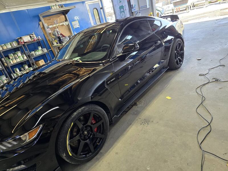 Sports car detailed under cover