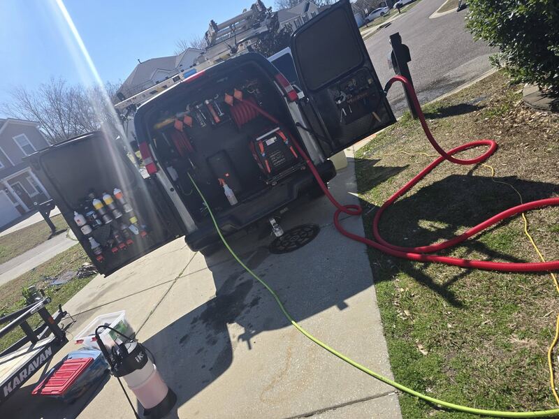 Inside the van, hoses and equipment racked